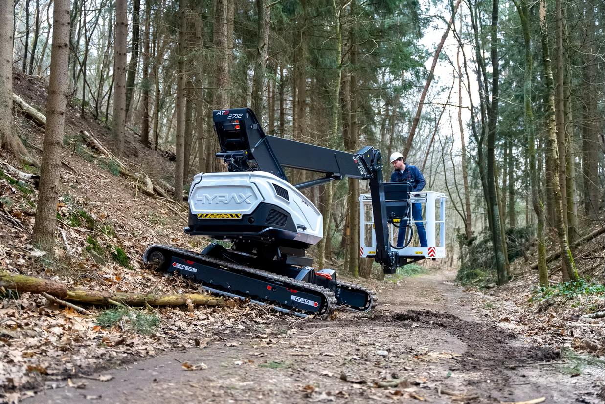 man on a new hyrax lift on rough terrain
